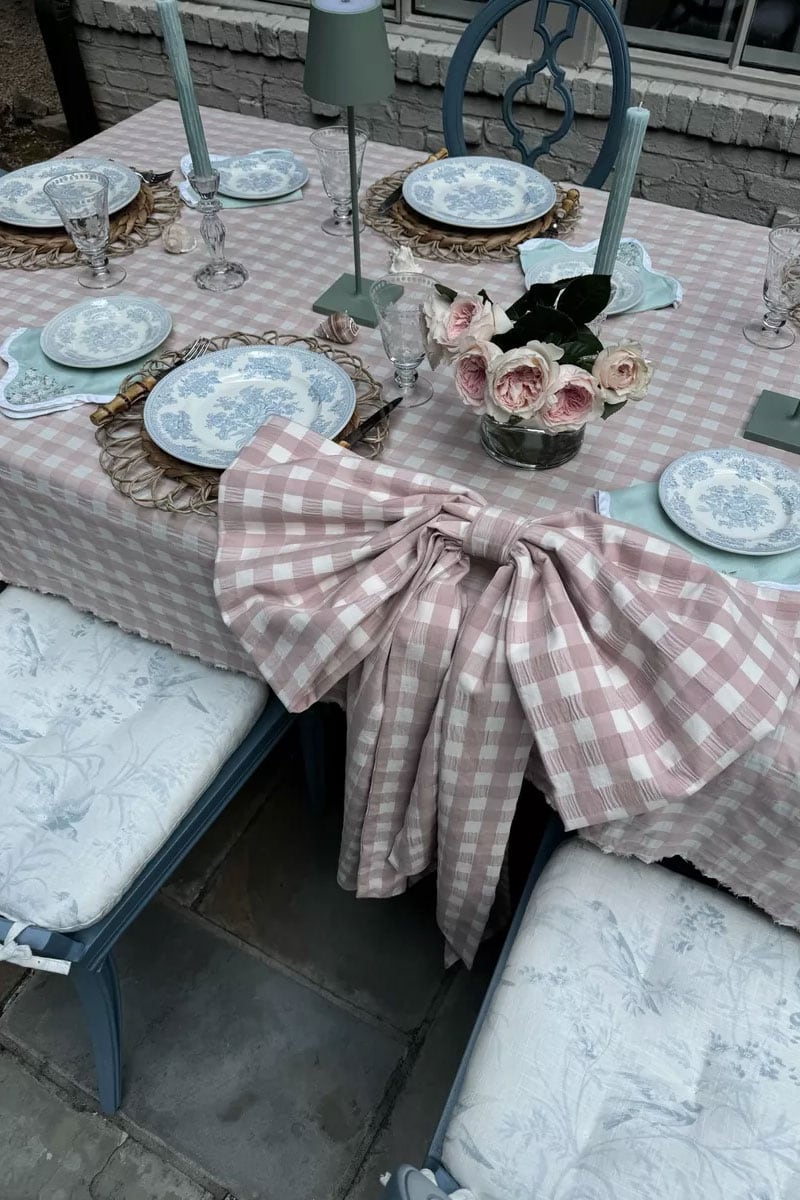 pretty grandmillennial table styling with gingham bow and blue plates