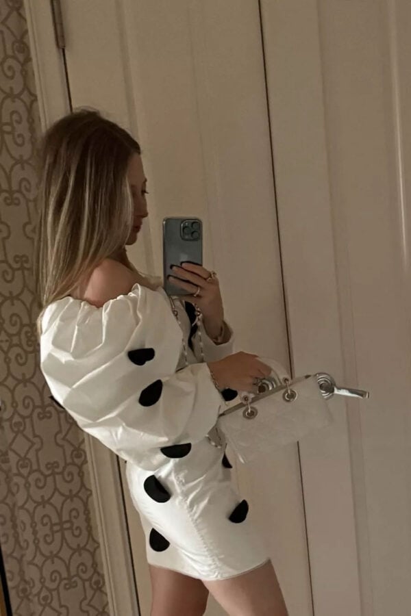 Emily wearing JACQUEMUS white dress with black polka dots