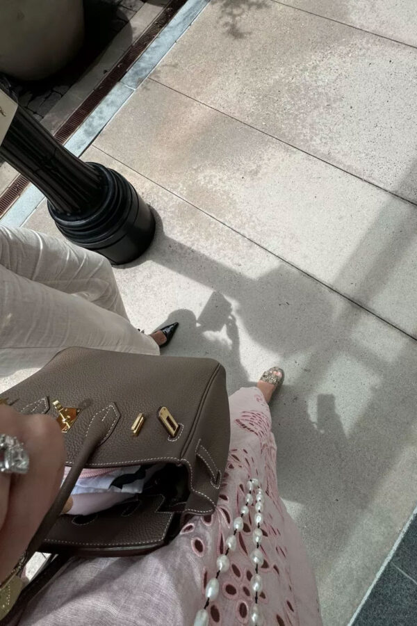 pink embroidered dress and bag