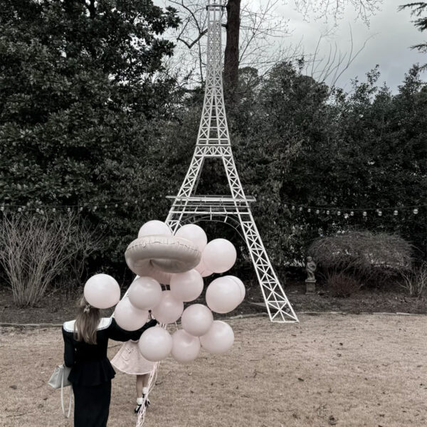 Balloons and Eiffel Tower decor at Paris party