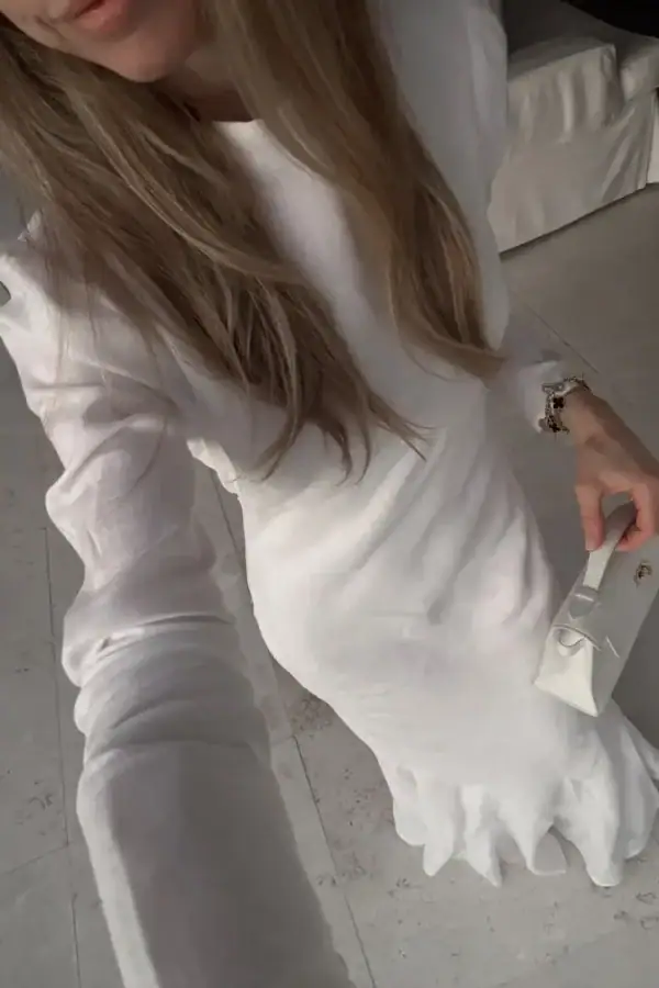Emily wearing DISSH Aisle White Linen Sleeve Midi Dress