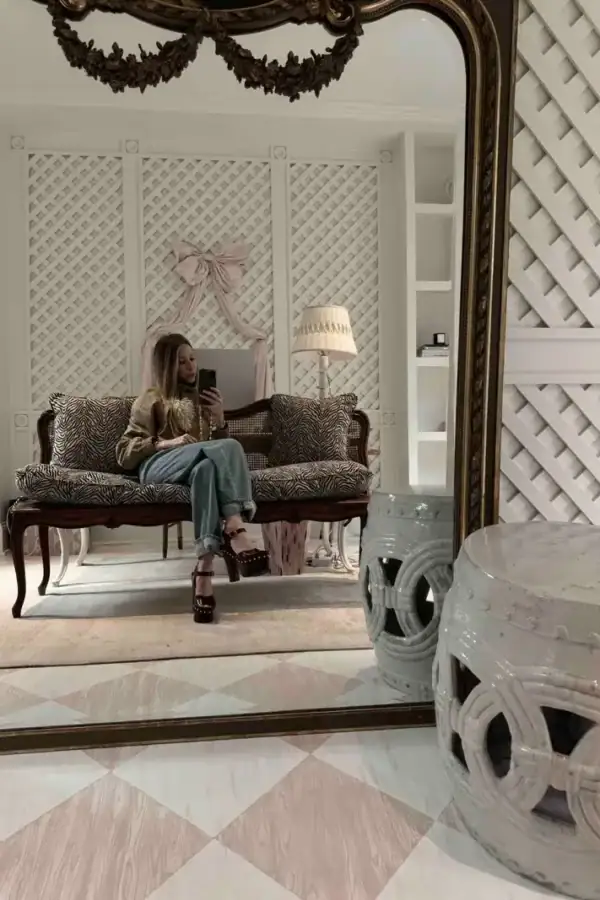 Emily of Born on Fifth wearing Rohe Jeans and Chloe Clogs (sitting in office)