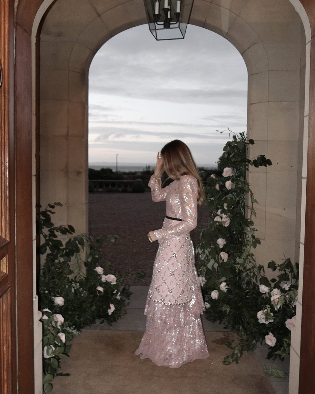 Blush and silver sparkly pink dress for 40th birthday, with garden roses in background